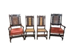 A set of four early 18th century caned walnut dining chairs, two with arms