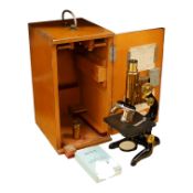 An early 20th century teak cased Ernst Leitz, Wetzlar brass and cast iron monocular microscope,