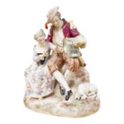 A German porcelain group of two figures with a bird cage and dog, 24cm high (Restored)
