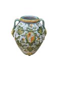 A large Italian Maiolica wine jar with spigot hole, twin handles with grotesque masks, all-over