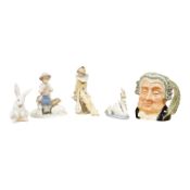Four Lladro and Nao figures and a Doulton Toby jug, The Lawyer, largest 20cm high