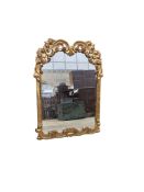 An 18th century style carved giltwood wall mirror, width 64cm, height 89cm