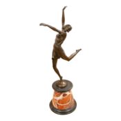 After Bruno Zach (1891-1945), an Deco style bronze of a dancing lady, raised on a marble and slate