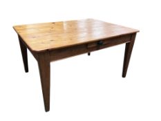 A mid 19th century rectangular pine kitchen table, fitted drawer on square tapered legs, width