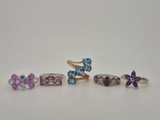 Five assorted modern 9ct gold and gem set rings including amethyst flower head with diamond chip