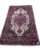 A Tabriz ivory ground rug, 208 x 125cm