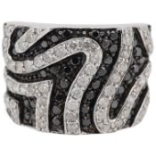 A recent 9ct white gold and two colour diamond cluster dress ring, of 'zebra' design, size N,