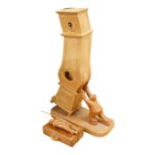 Pierre Decorse (b.1953), a naturalistically modelled wooden sculpture of a grandfather clock and a