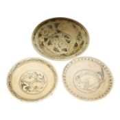 A group of three Thai underglaze blue or black crackle glaze dishes, two decorated with fish,
