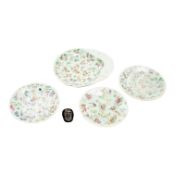 A Japanese bronze mask and four famille rose dishes - largest 29cm