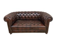 A Victorian style buttoned brown leather Chesterfield settee, width 170cm, depth 84cm, height 76cm