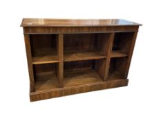 A Regency style feather banded walnut dwarf open bookcase, width 140cm, depth 42cm, height 94cm