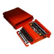 An Olivetti Valentine typewriter in red with tool case