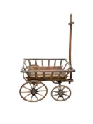 A Victorian iron bound dog cart, length 75cm, width 47cm