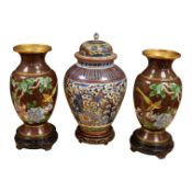 A pair of cloisonné vases on stands and Chinese clobbered vase and cover on stand (damaged). 44cm