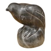 An Inuit stone carving of a falcon by Isapik, 18cm high