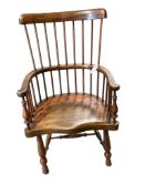 An early 20th century elm and beech Windsor comb back elbow chair, width 57cm, depth 42cm, height