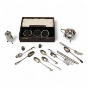 Three assorted 20th century silver napkin rings, a George V silver mustard pot and pepperette, a set