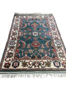 A Tabriz blue ground rug, 204 x 134cm.