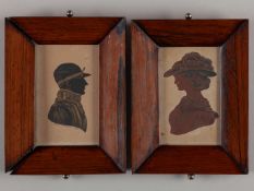 A pair of 19th century silhouette portraits of a jockey and a lady.