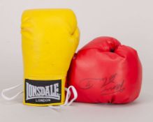 Boxing gloves signed by the British champions Frank Bruno and Nigel Benn