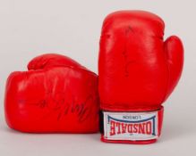 A pair of boxing gloves signed by British boxing rivals Nigel Benn and Chris Eubank