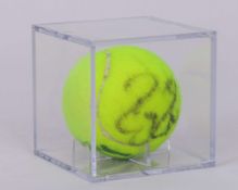 An autographed Roger Federer Wimbledon tennis ball, 2006