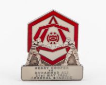 An Arsenal F.C. Henry Cooper v. Muhammad Ali lapel limited edition lapel badge