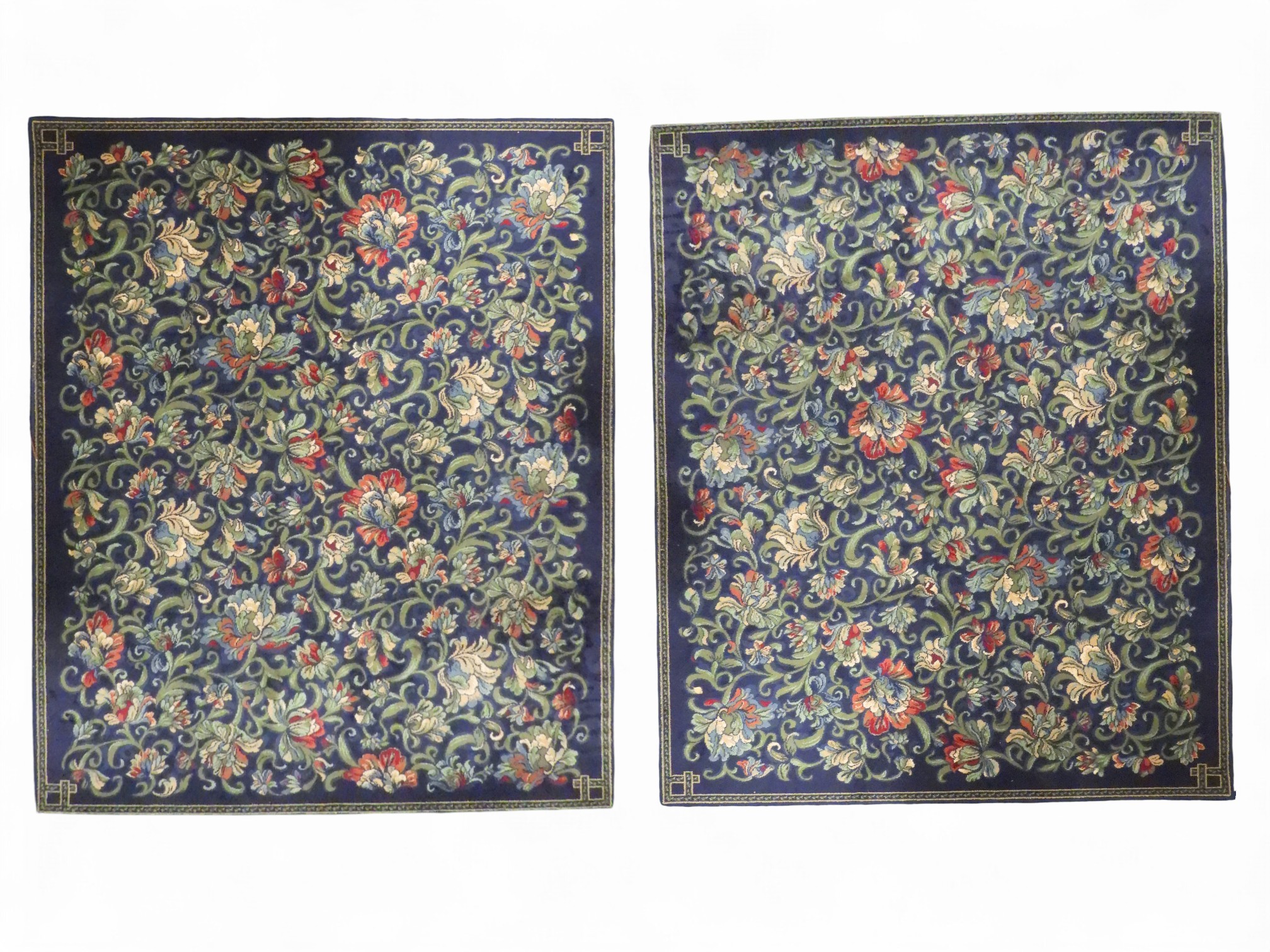 A lot of two assorted dark blue ground Axminster carpets with all over ...