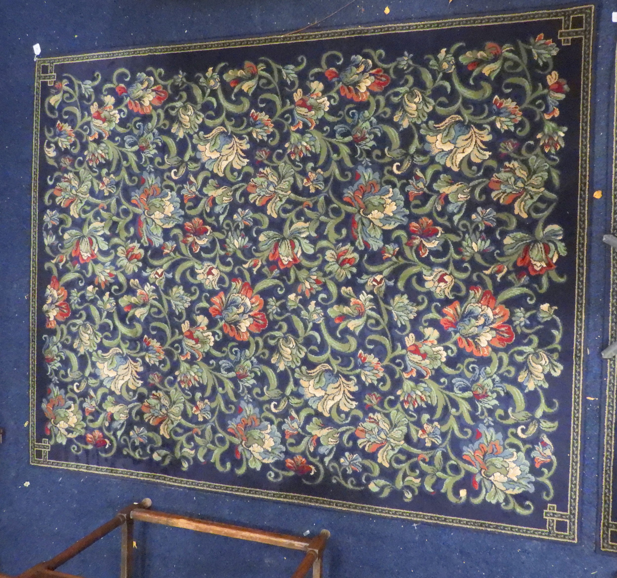 A lot of two assorted dark blue ground Axminster carpets with all over ...