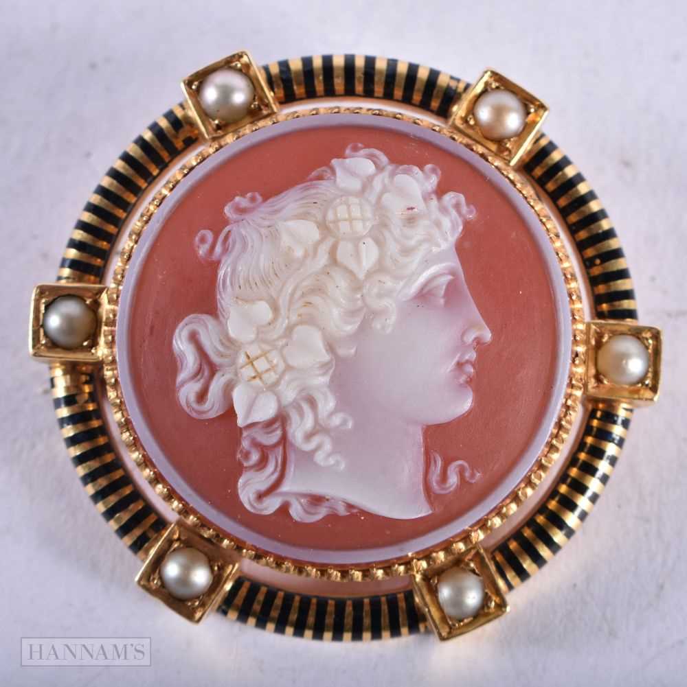 A Hardstone Cameo Brooch mounted in a High Carat Gold and Black Enamel surround inset with Pearls.