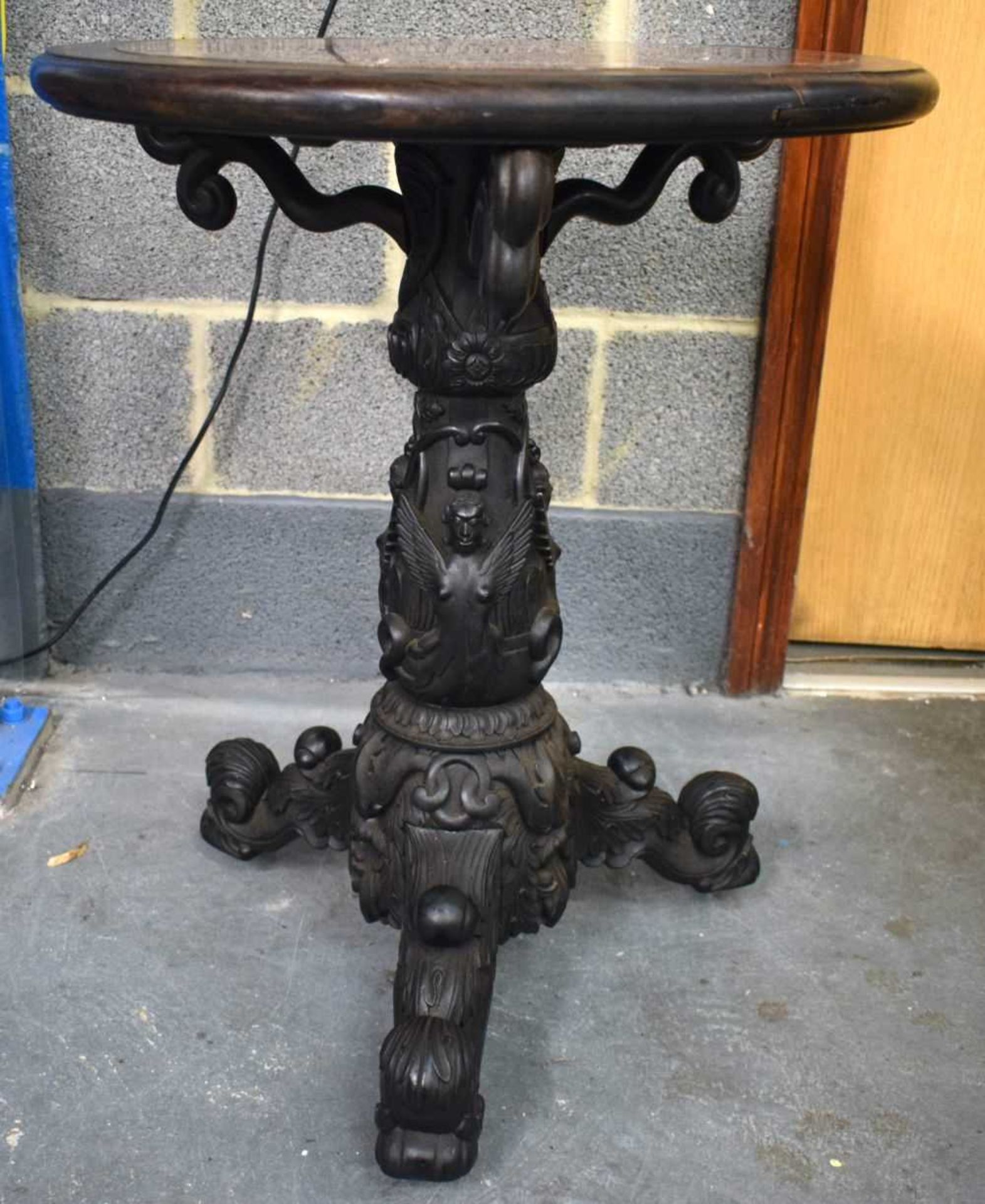 A VERY RARE 19TH CENTURY CHINESE CARVED HARDWOOD STAND with unusual Indian style supports, inset