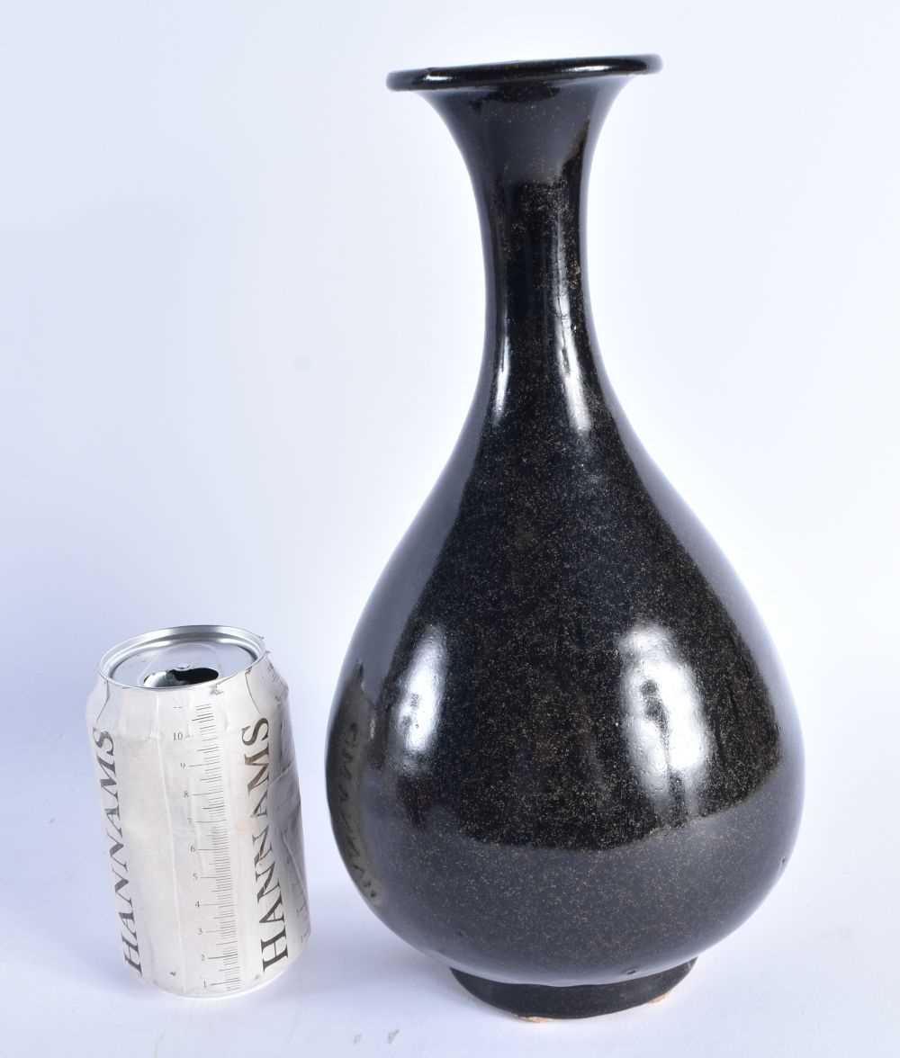 A CHINESE QING DYNASTY TEA DUST BLACK GLAZED POTTERY VASE. 30 cm high.