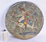 A LARGE 19TH CENTURY PERSIAN QAJAR POTTERY TILE painted in relief with a figure on horseback. 40