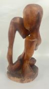 A LARGE ABSTRACT CARVED HARD WOOD SCULPTURE H 51CM.