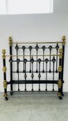 AN ANTIQUE WROUGHT IRON AND BRASS 4FT 6 BEDSTEAD.