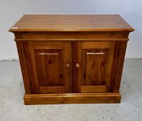 A HONEY PINE 2 DOOR CUPBOARD W 96 X D 45 X H 77.5CM.