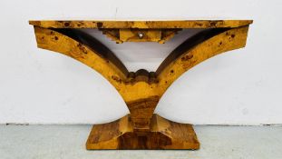 A REPRODUCTION BURR WALNUT BUTTERFLY CONSOLE TABLE IN THE STYLE MEOLA INTERIORS,