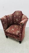 A VICTORIAN TUB CHAIR UPHOLSTERED IN A WOVEN ARMORIAL PATTERN,