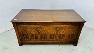 AN OAK FINISH BLANKET CHEST WITH GOTHIC FRONT PANEL DESIGN W 100CM D 48CM H 48CM.