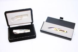 A BOXED HERBERTZ MESSER PEARL HANDLED ROSTFRET 440 POCKET KNIFE AND BOXED CRKT 10th ANNIVERSARY