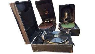 A portable gramophone by HMV, together with two ot