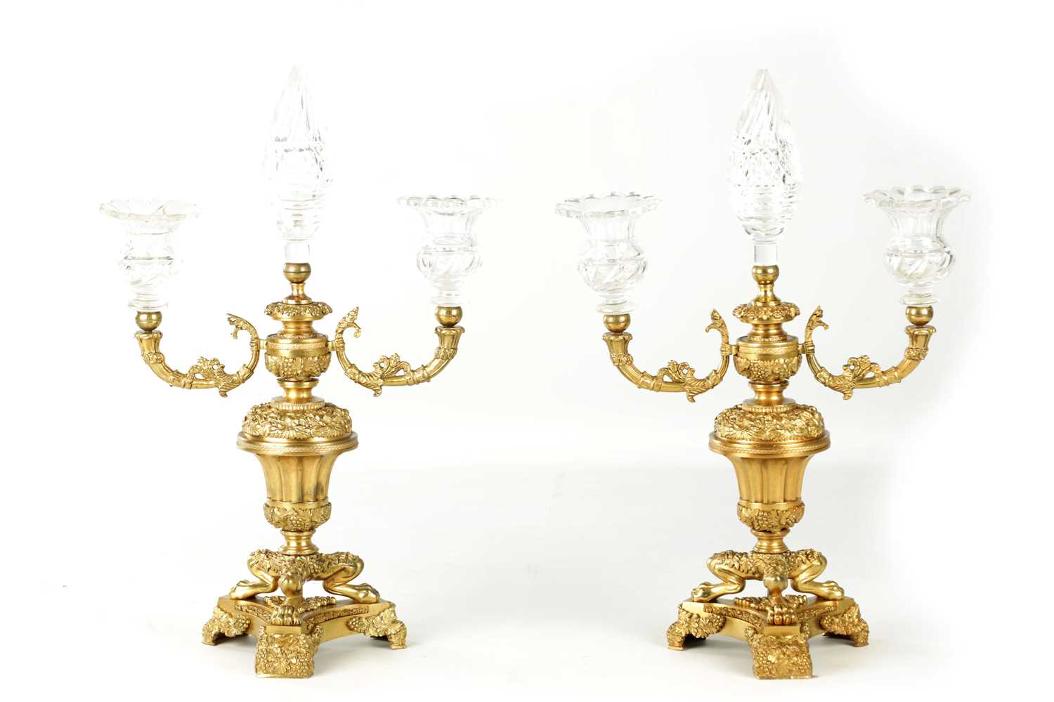 A PAIR OF LATE 19TH CENTURY REGENCY STYLE FRENCH ORMOLU AND CUT GLASS CANDELABRA