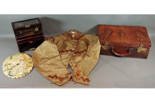 A leather traveling case together with a ladies jacket, a silkwork picture and a jewellery box in