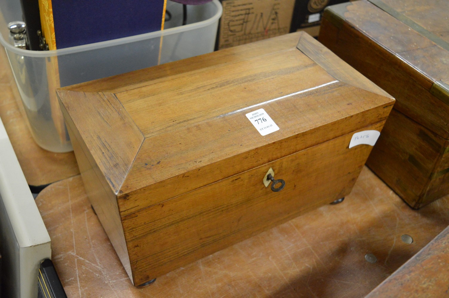 A sarcophagus shaped tea caddy.