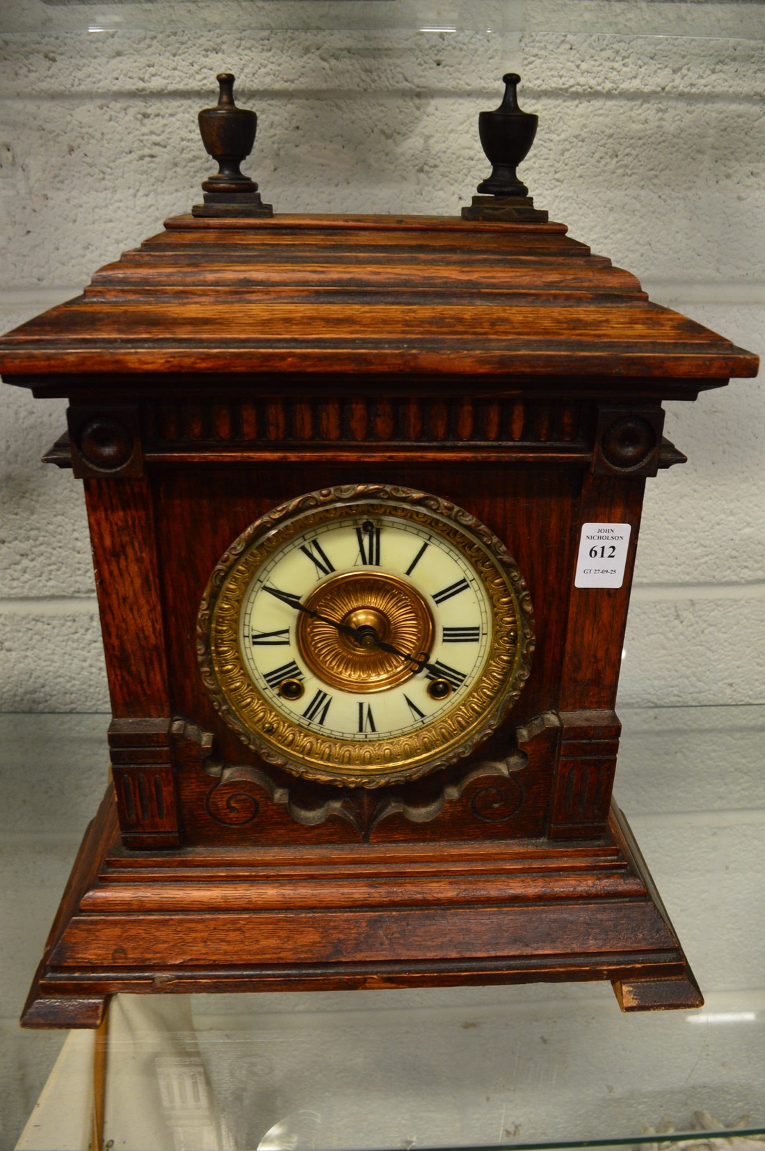 A large oak cased mantel clock.