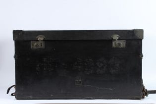 A BLACK LEATHER TRUNK with leather carrying handle. 74cms high.