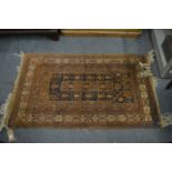 Persian rug, with stylised decoration, moth damage, 132cm x 80cm.