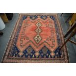 Persian rug, pink ground with stylised decoration, 205cm x 160cm.