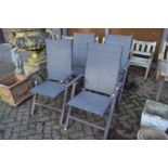 Four folding garden chairs.